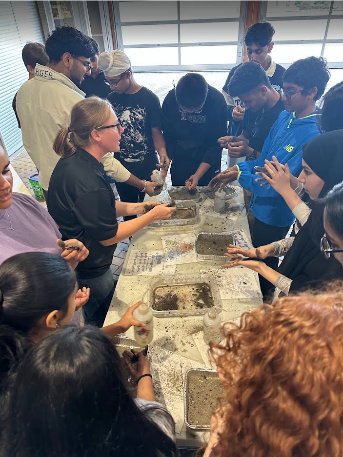 Students doing a hands-on soil texture activity