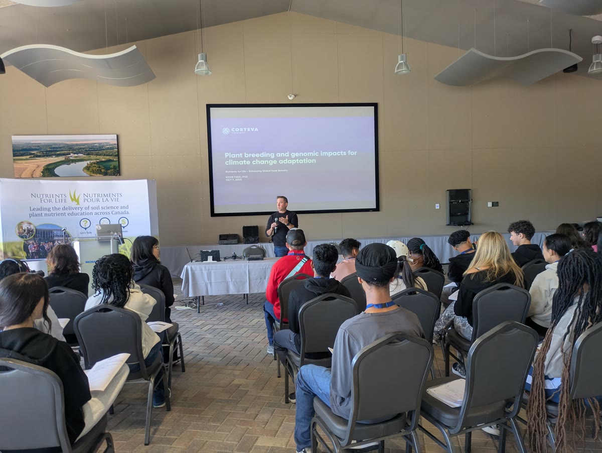 Students listening to a presentation at the student summit